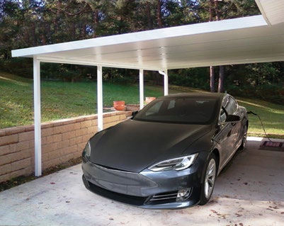 Custom Deck Builder for Homeowners - M2 Decks & Enclosures A white structural aluminum carport with a solid insulated roof protecting a luxury electric vehicle on a concrete driveway.
